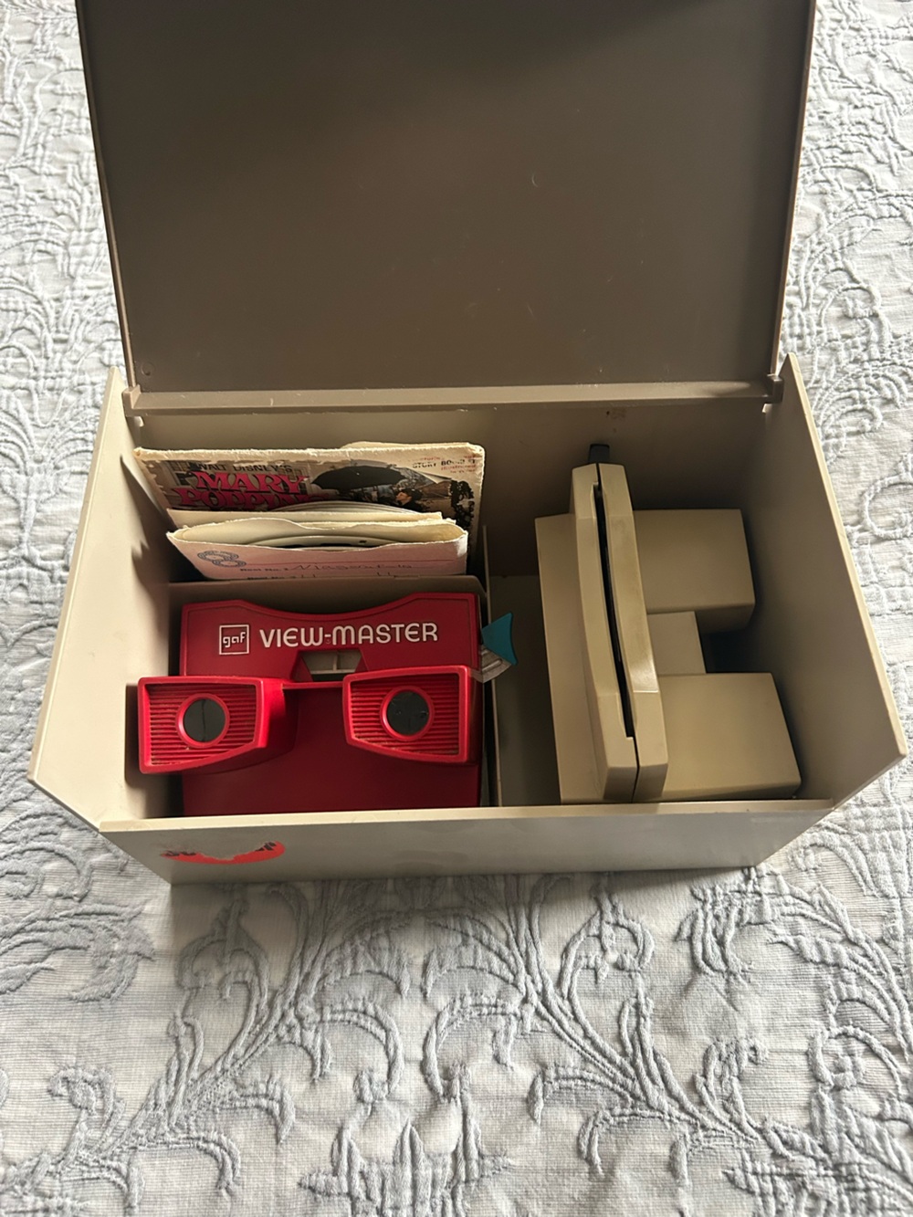 VINTAGE View-Master lot – 2 viewers (red + beige), reels, and storage case.